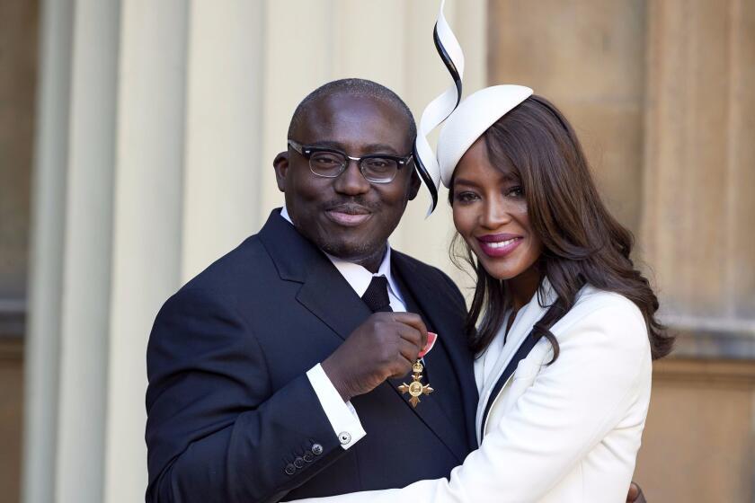 Mandatory Credit: Photo by REX/Shutterstock (6897943w) Edward Enninful after receiving his Officer of the Order of the British Empire (OBE) and Naomi Campbell Investitures at Buckingham Palace, London, UK - 27 Oct 2016