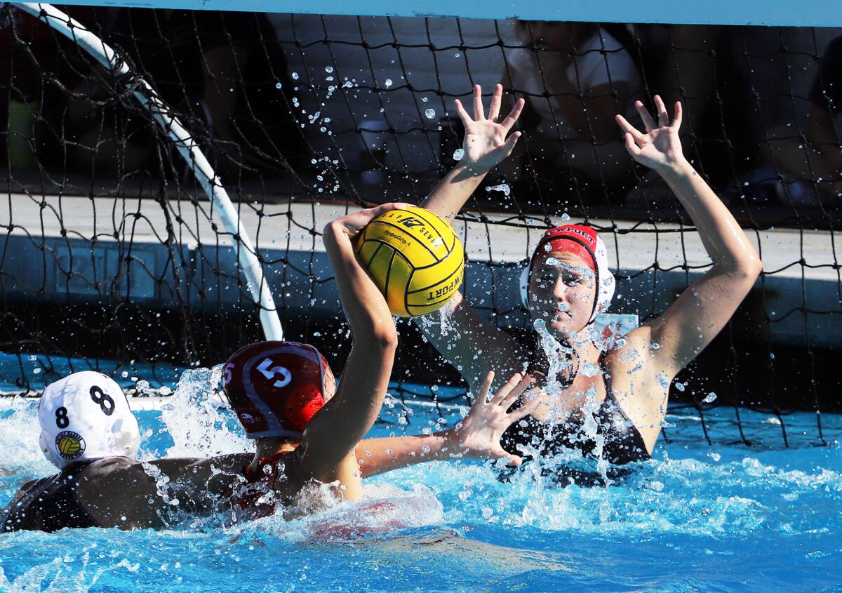 Newport Harbor goalie Lydia Soderberg (1) tries to block Mater Dei's Penny Mauser (5) during Saturday's action.