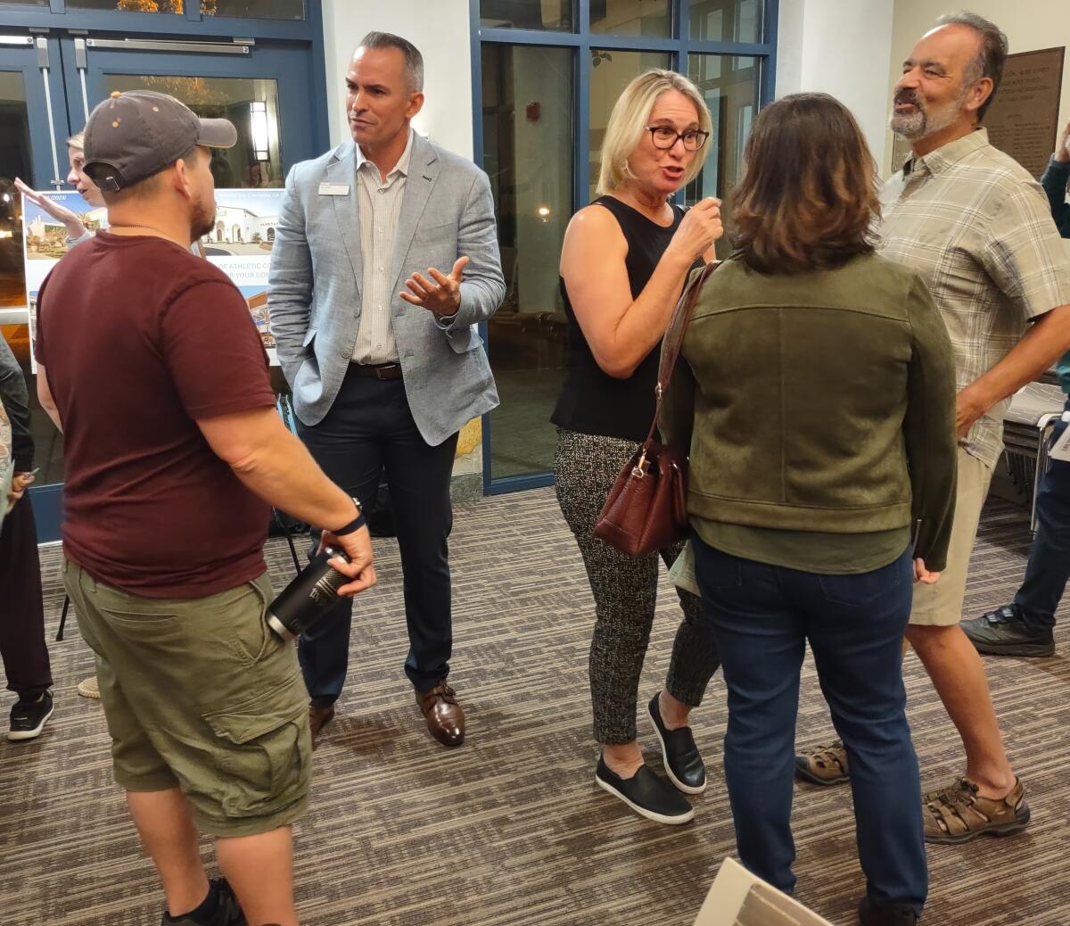 Life Time Vice President of Club Operations Brian Gaeta, second from left, talks to visitors at a Nov. 1 Open House meeting.