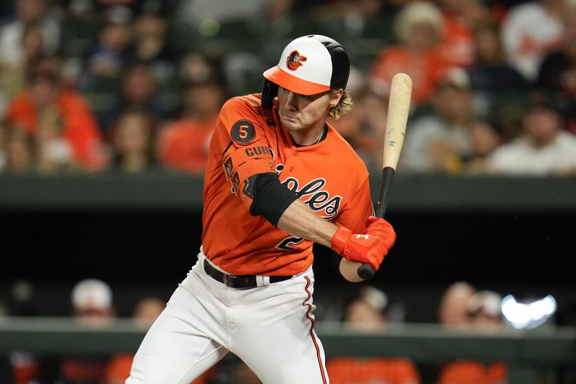 Baltimore Orioles' Gunnar Henderson swings at a pitch from the Boston Red Sox during the first inning of a baseball game, Saturday, Sept. 30, 2023, in Baltimore. (AP Photo/Julio Cortez)