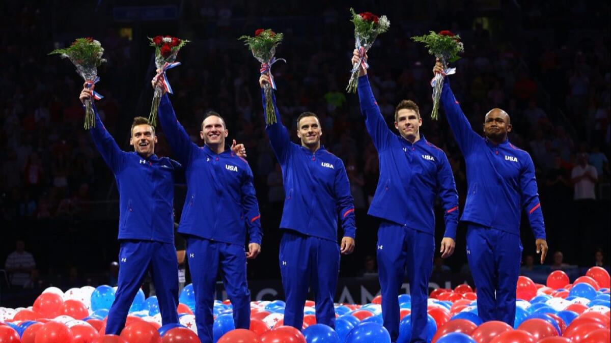 Sam Mikulak, Alex Naddour, Jacob Dalton, Chris Brooks and John Orozco celebrate after being named to the U.S. men's gymnastics team.