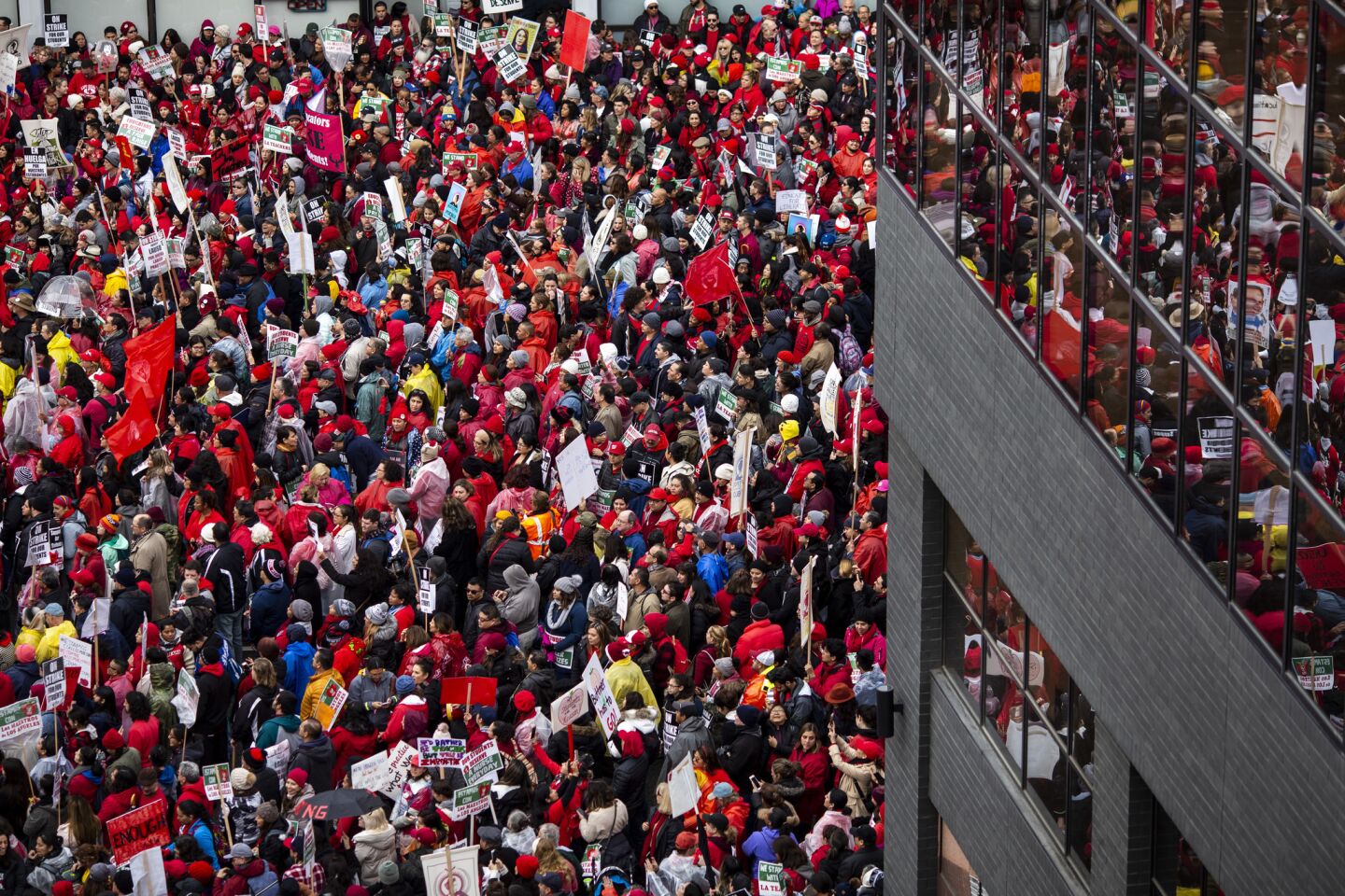 Educators and supporters pack San Pedro Street in downtown Los Angeles at a rally outside the headquarters of the California Charter Schools Association.