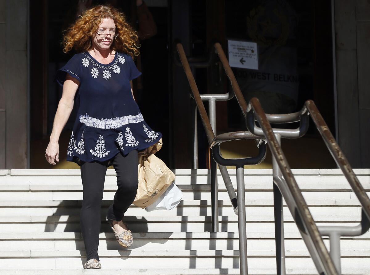 Wearing a GPS monitor on her left ankle, Tonya Couch leaves the Tarrant County Community Supervision and Corrections Department in Fort Worth on Jan. 12.