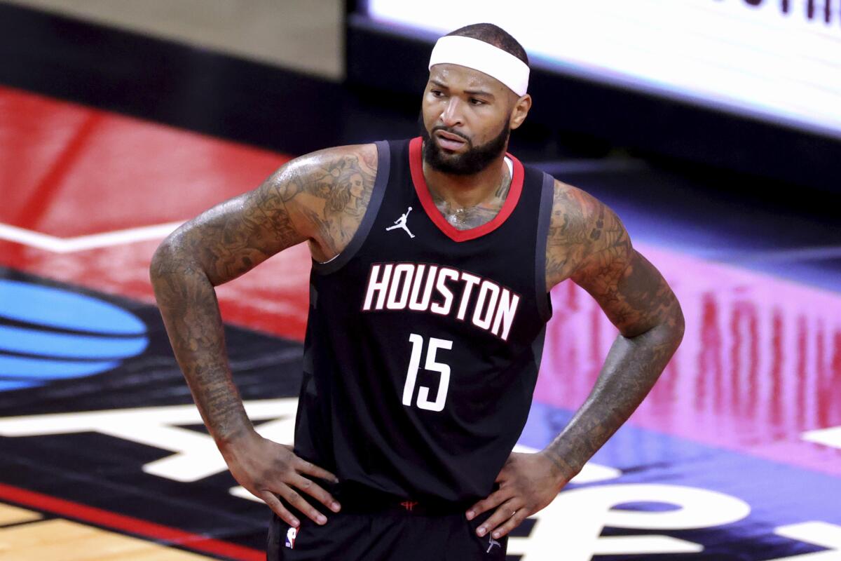 DeMarcus Cousins catches his breath during a pause in a Rockets game.