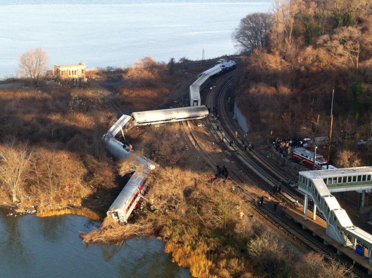 Cars from a Metro-North passenger train are scattered after the train derailed in the Bronx borough of New York.