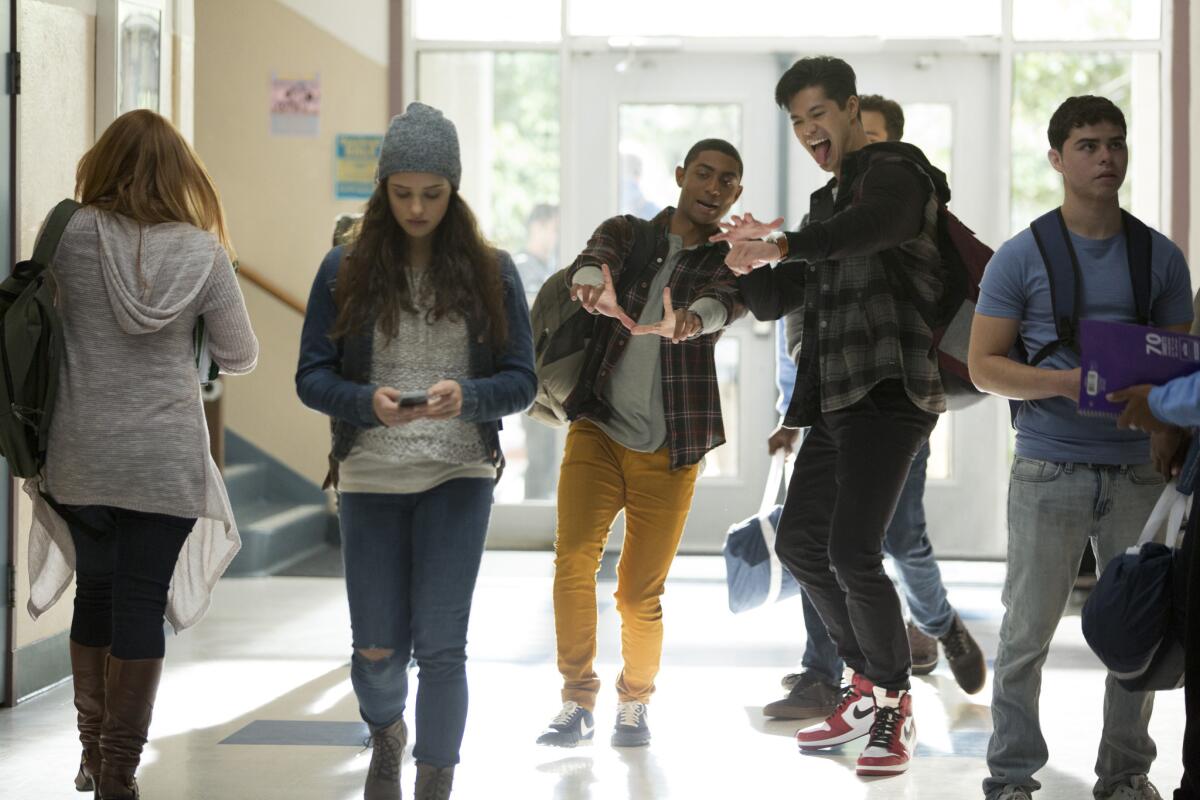 Katherine Langford (as Hannah Baker) is teased in her school's hallways in a scene from "13 Reasons Why." (Netflix / Beth Dubber)