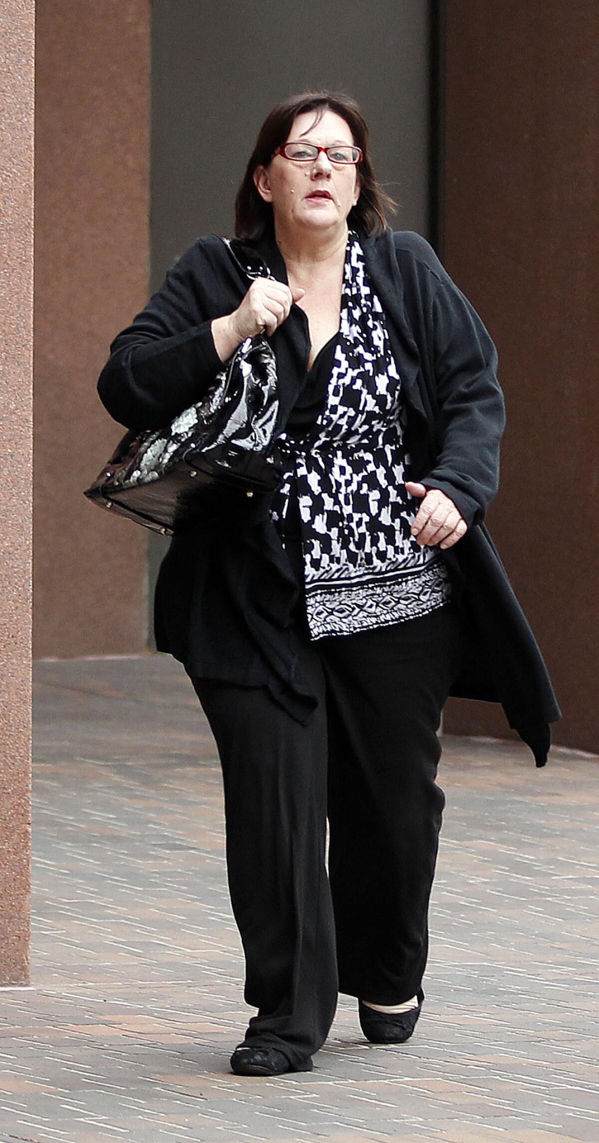 Carla Chambers arrives in San Diego federal court in 2012 during a baby-selling case. Tuesday, she was sentenced for running an unlicensed puppy mill.