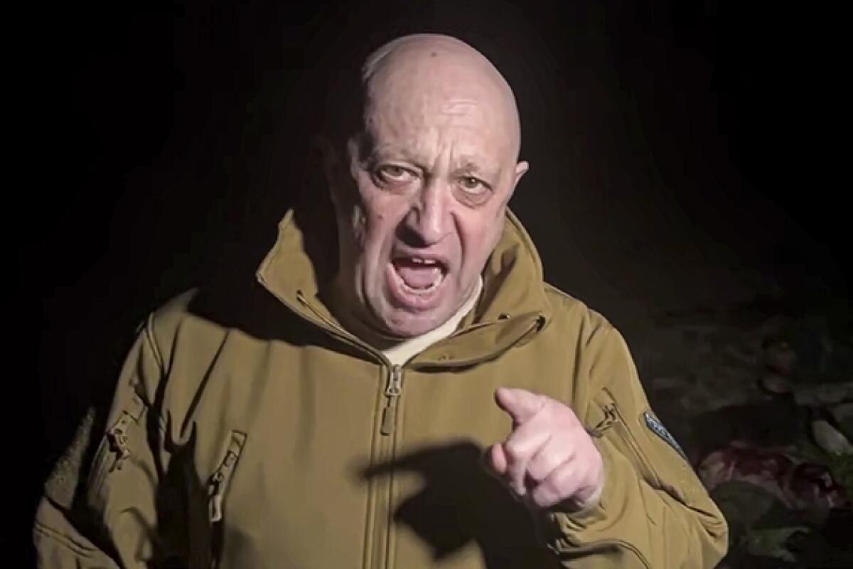Wagner Group Yevgeny Prigozhin points and speaks in a spring video. 