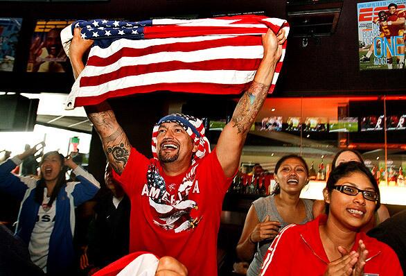 Cheers and smiles break out at the L.A. Live ESPN Zone as the U.S. soccer team is saved from elimination in the World Cup with a goal by Landon Donovan in the U.S. -Algeria match.