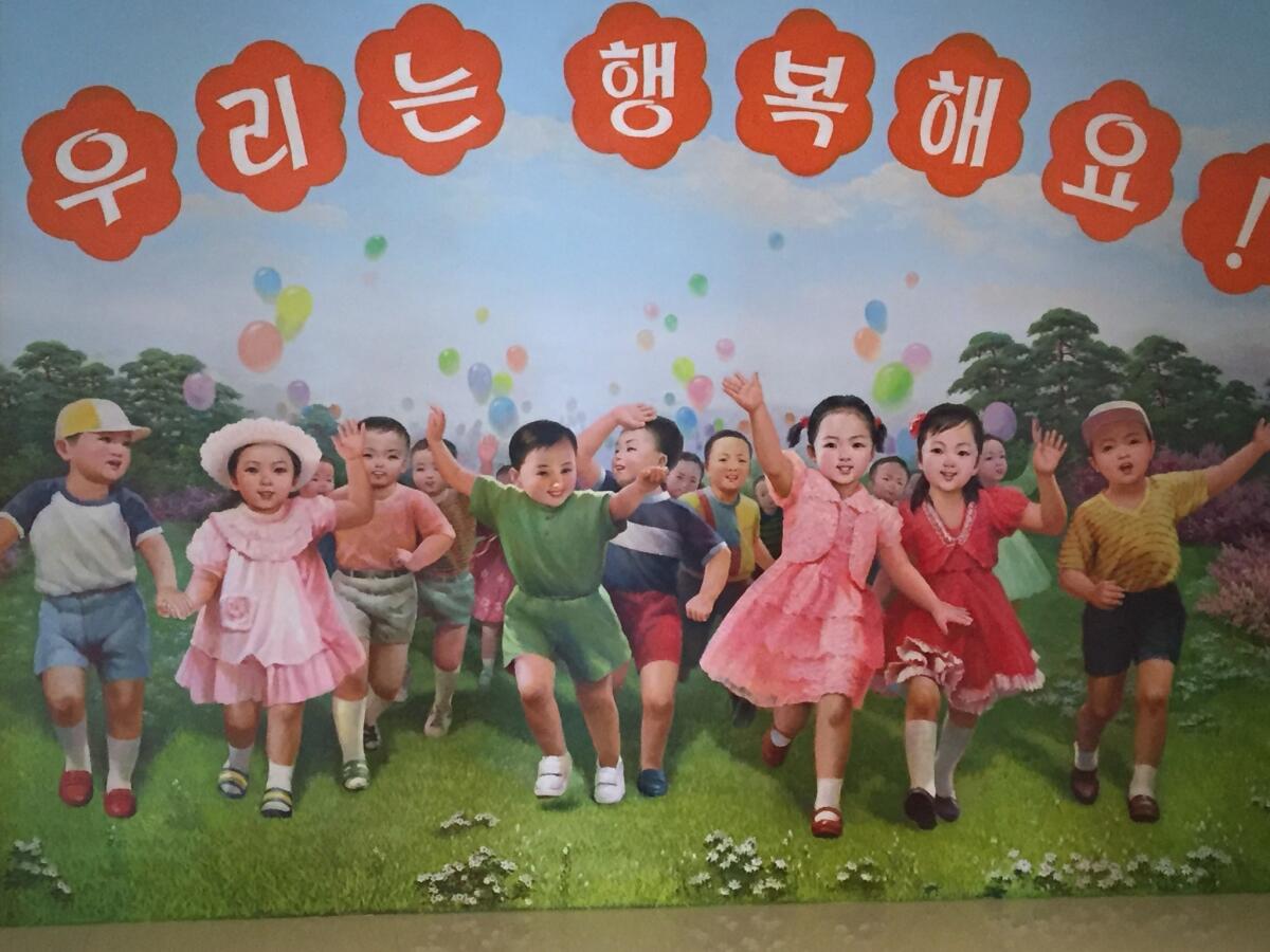 A mural in the entry hall to the Changchon nursery school says "we are happy."