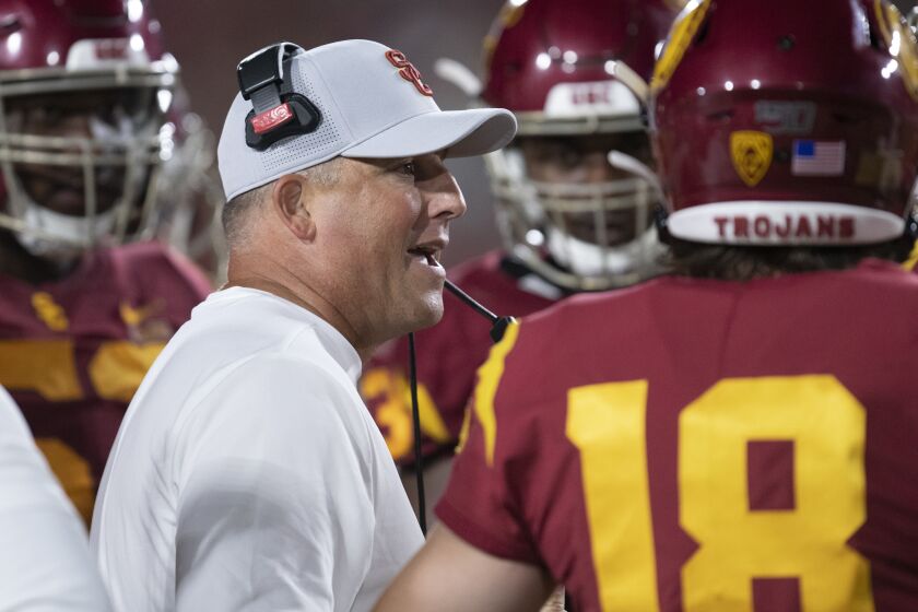 Southern California head coach Clay Helton gives instructions to his players in an NCAA football game against Fresno State Saturday, Sept. 31, 2019, in Los Angeles. (AP Photo/Kyusung Gong)