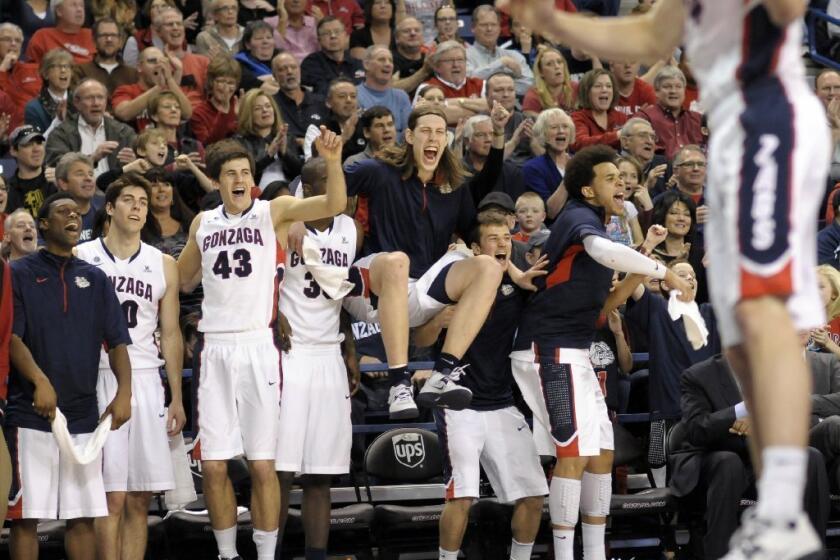 The Gonzaga bench reacts after the Bulldogs' win over Portland.