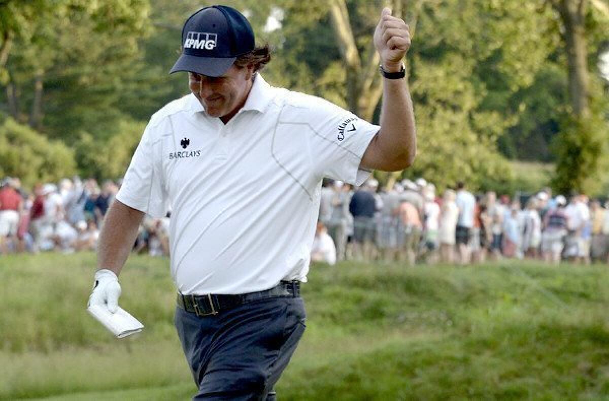 Phil Mickelson reacts to the gallery after making a birdie putt at No. 17 on Saturday during the third round of the U.S. Open at Merion Golf Club.
