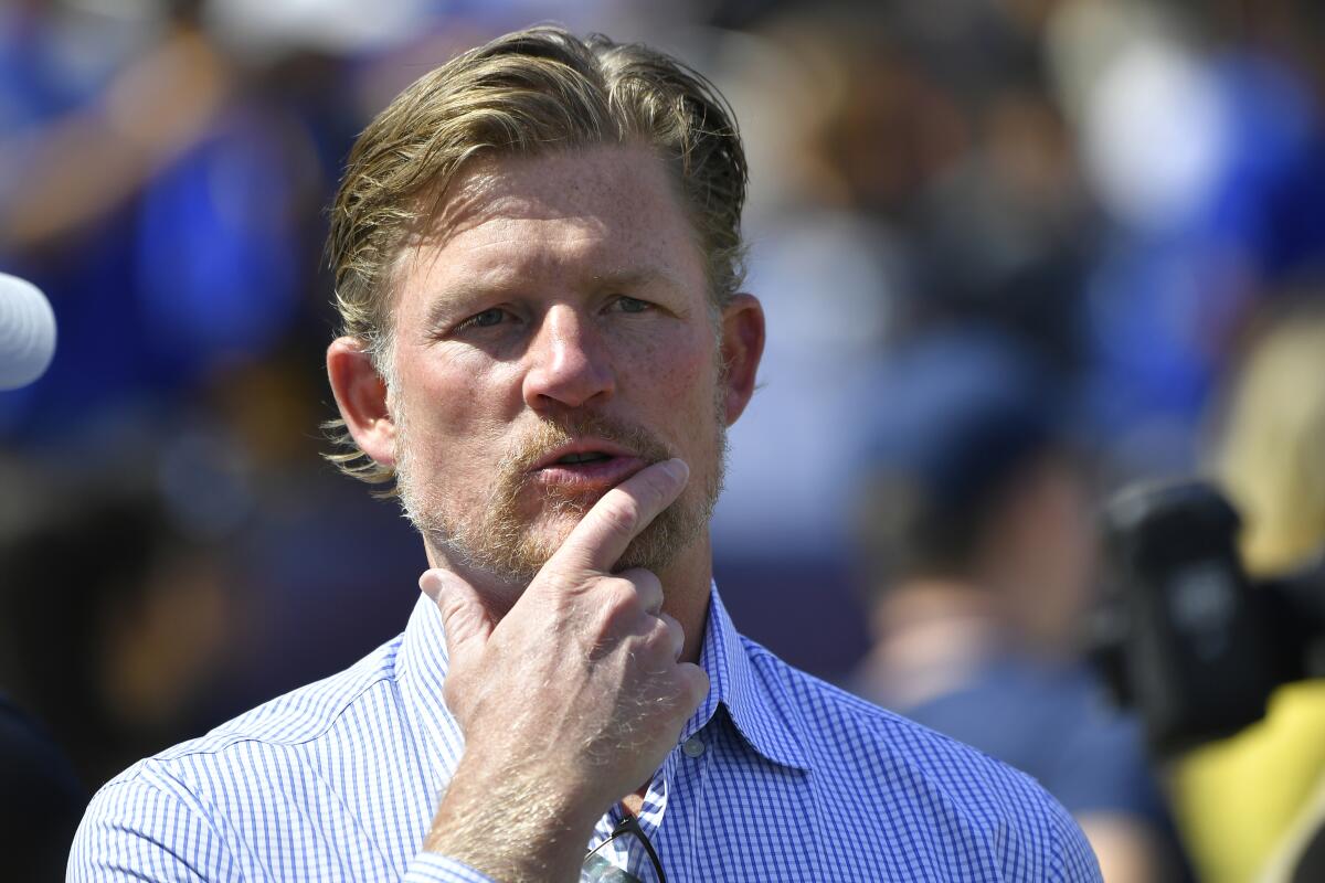 Rams general manager Les Snead stands on the sideline before a game against the Tampa Bay Buccaneers at the Coliseum on Sept. 29.