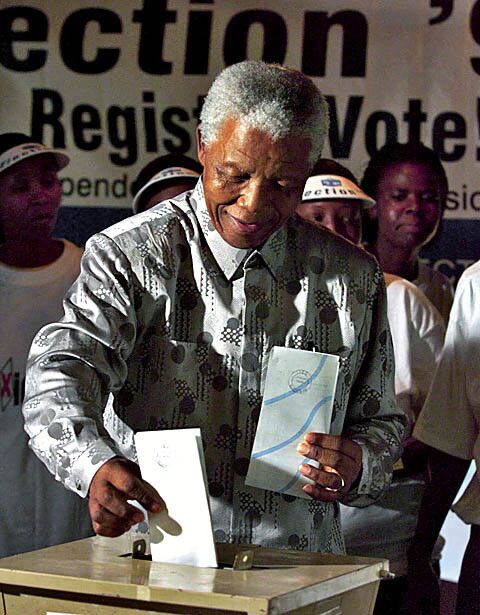 Mandela, then the outgoing president, casts his ballot at a Johannesburg polling station during South Africa's 1999 election.