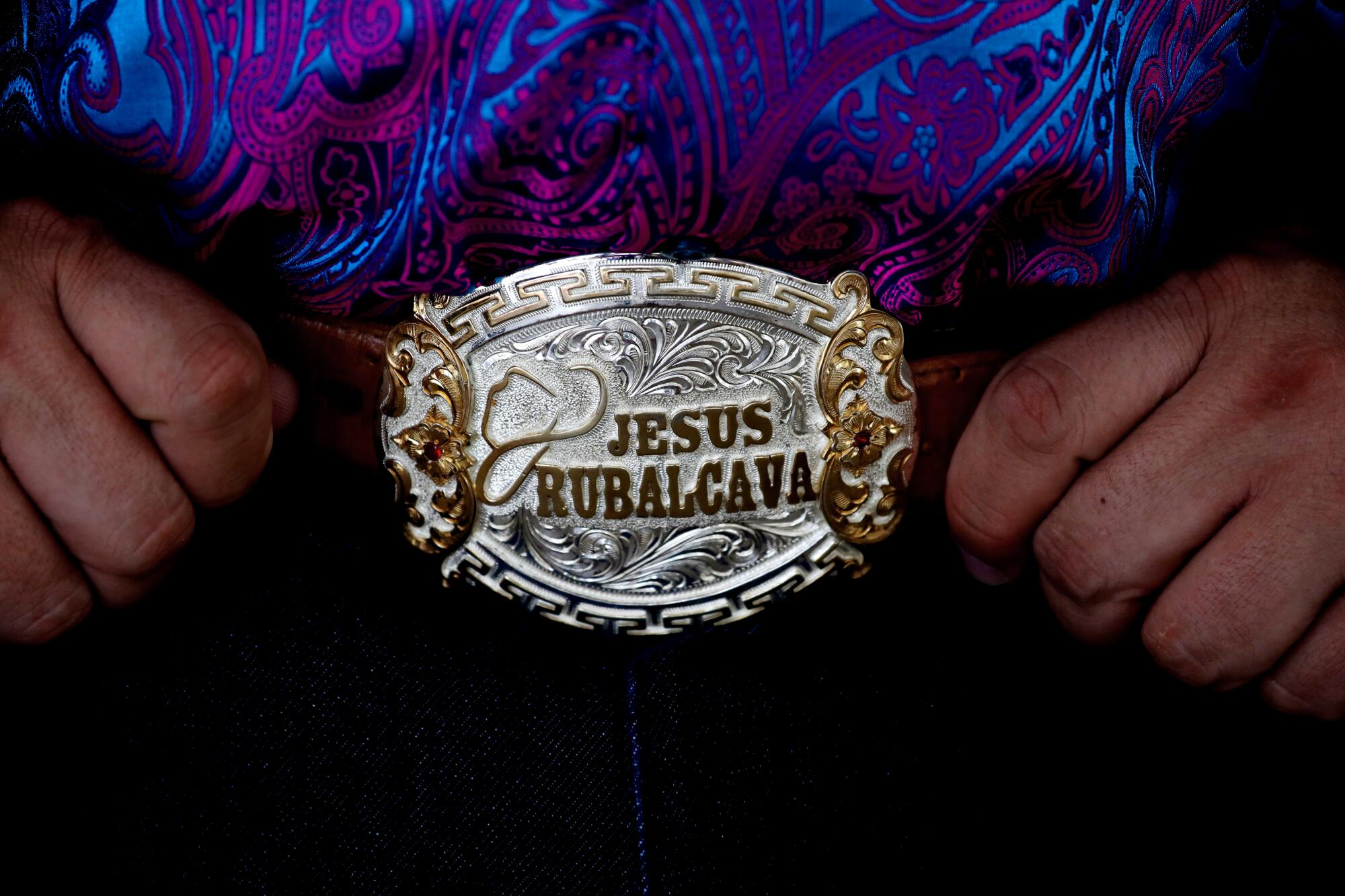  Jesus Rubalcava, 43, of Gila Bend, Arizona, displays his embossed belt buckle at a welcoming luncheon at Alicia Garden 