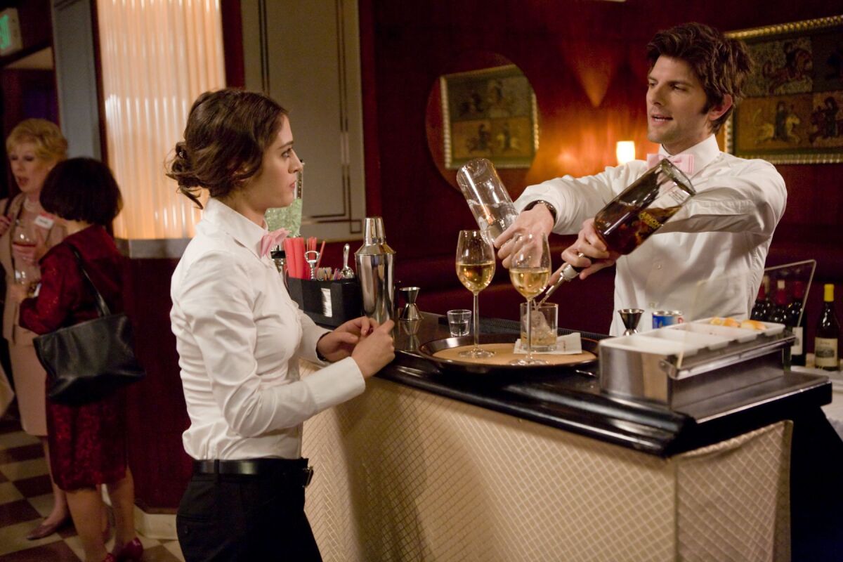Lizzy Caplan and Adam Scott  in "Party Down."