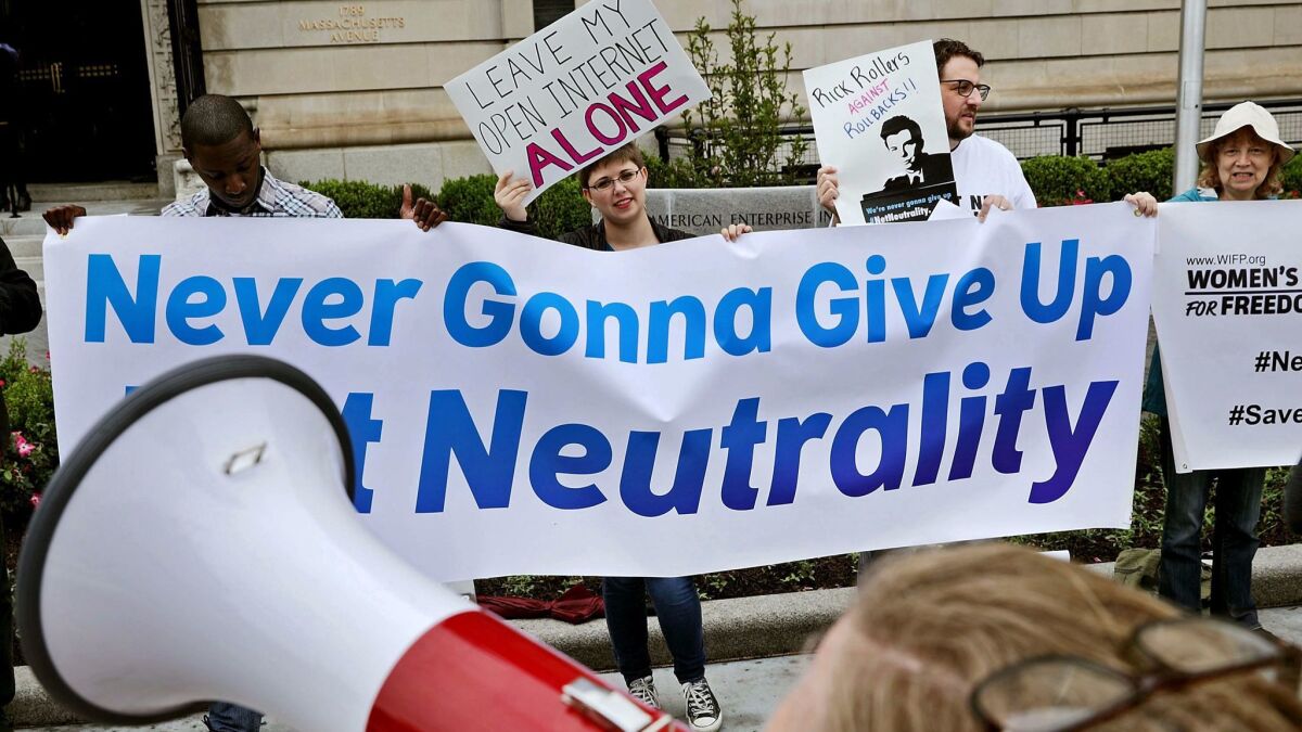 Proponents of net neutrality protest against Federal Communication Commission Chairman Ajit Pai outside the American Enterprise Institute before his arrival May 5 in Washington.
