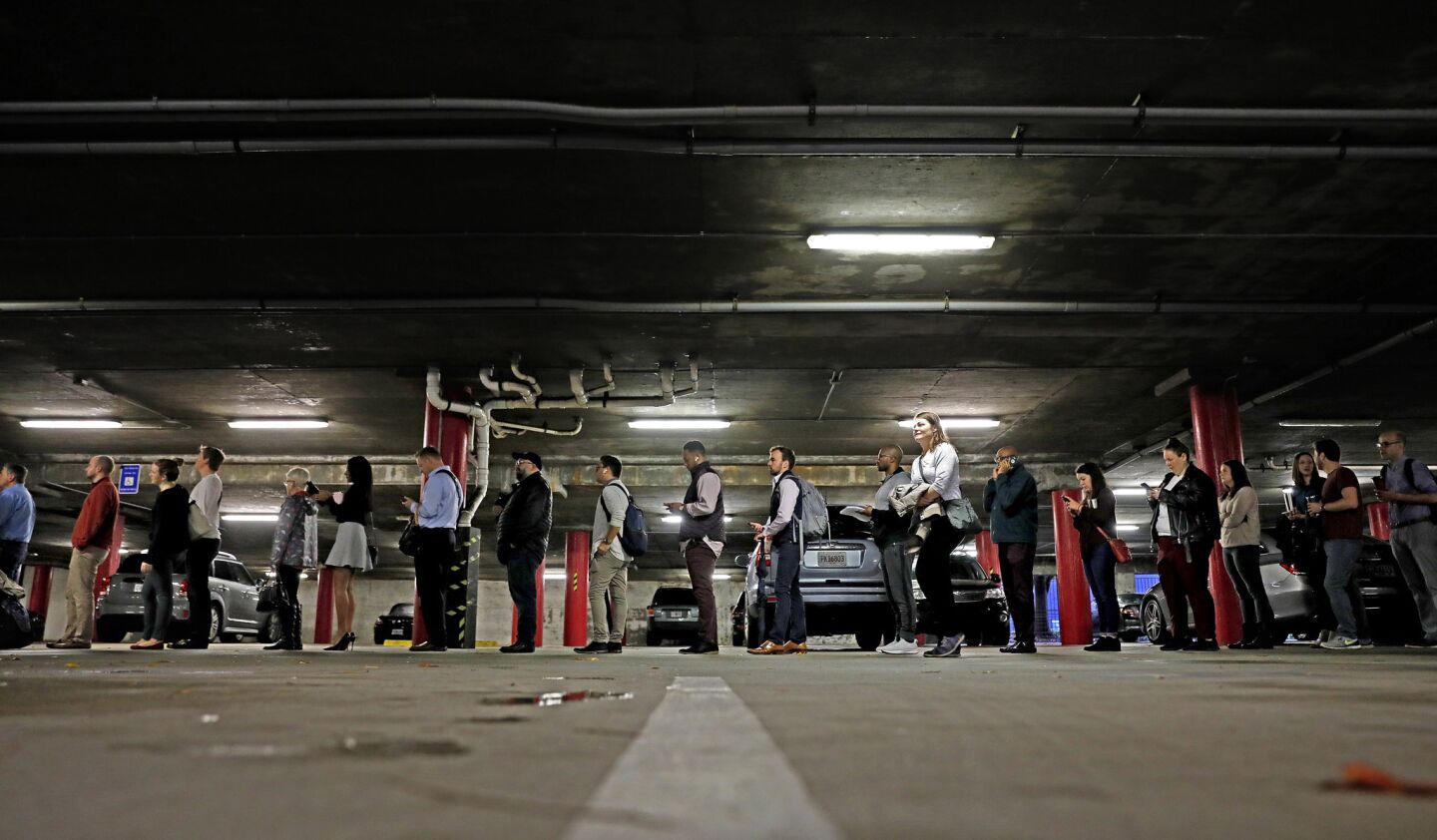 A line backs up into a parking garage outside a polling site on election day in Atlanta.