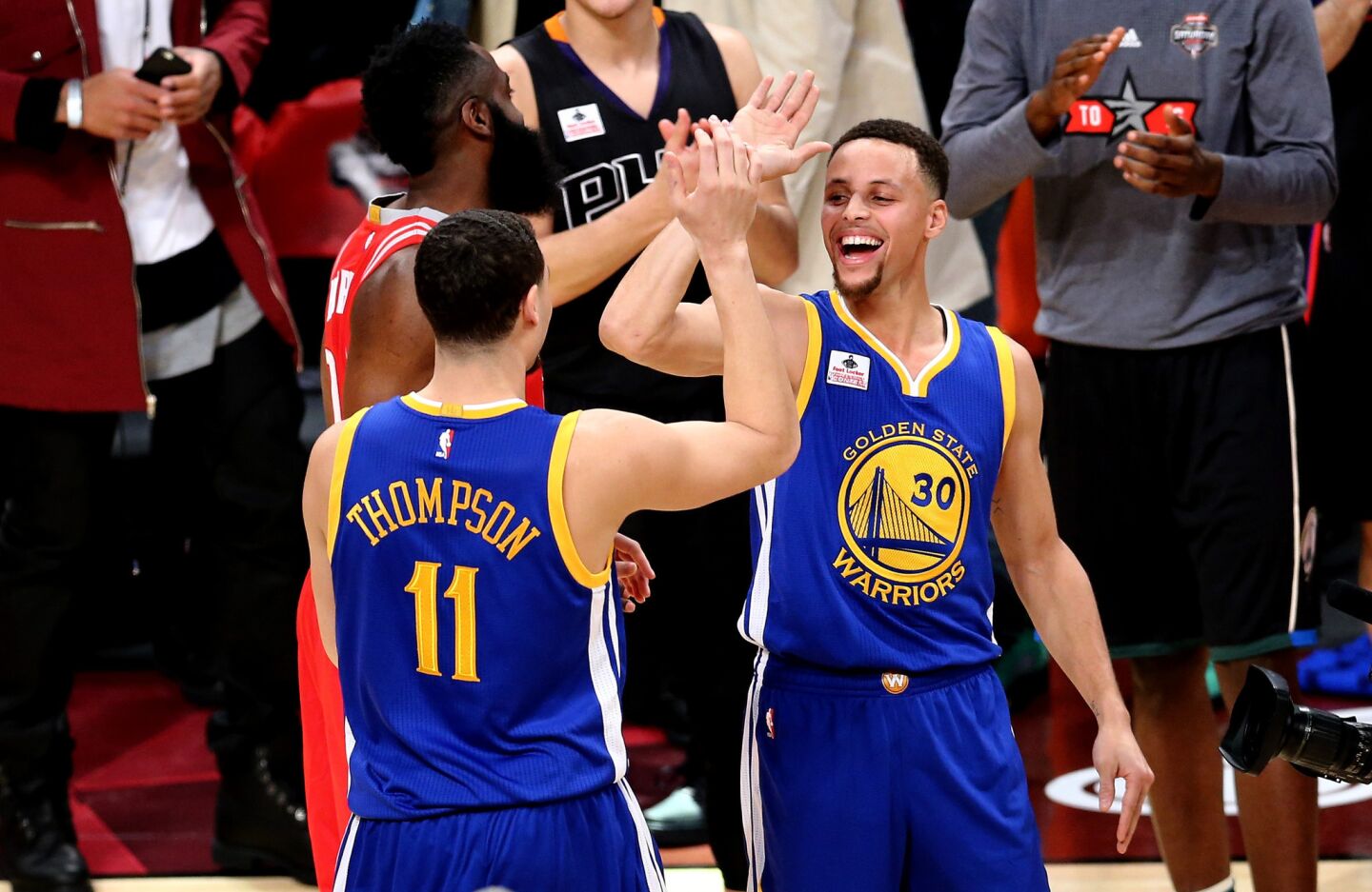 Golden State guard Klay Thompson is congratulated by teammate Stephen Curry after winning the Three-Point Contest on Saturday.