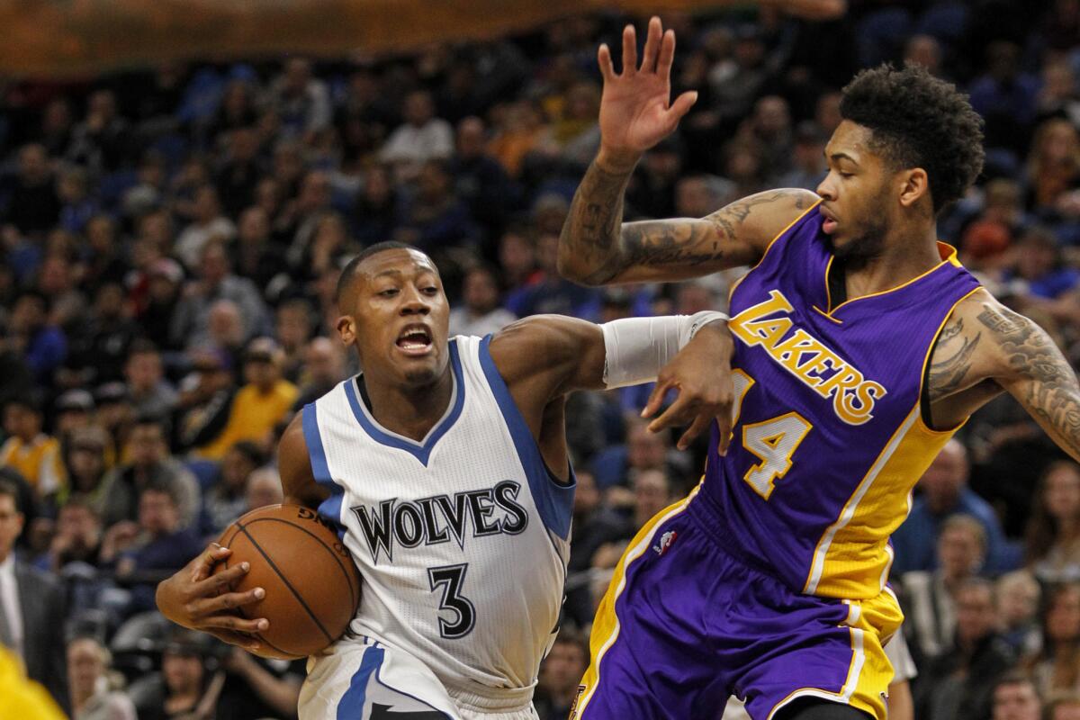 Timberwolves guard Kris Dunn (3) drives to the basket against Lakers forward Brandon Ingram (14) in the second quarter on Nov. 13.