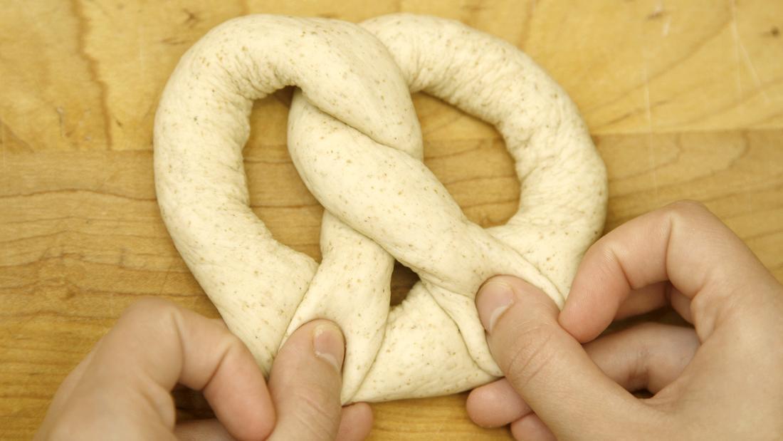 Twist the ends over, then pinch to connect the ends to form the pretzel.