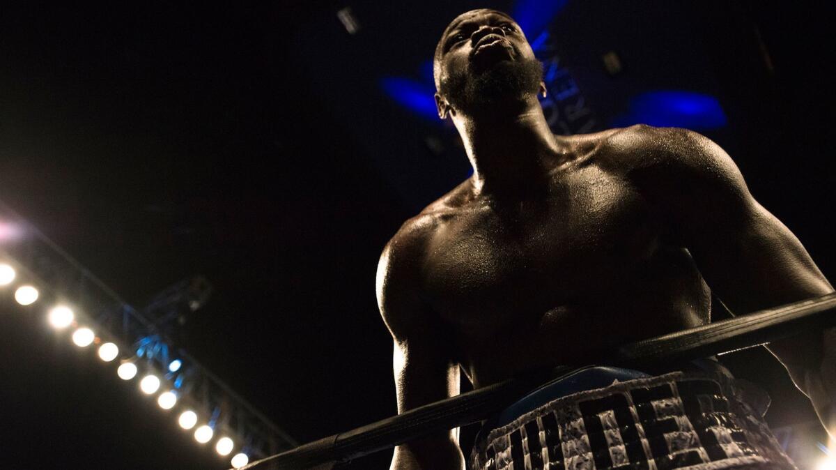 Deontay Wilder looks out at the crowd after knocking down Gerald Washington during the WBC heavyweight title bout Feb. 25.