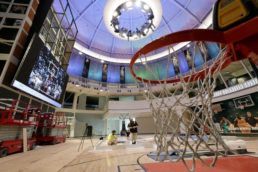 Workers perform restorations at the Naismith Memorial Basketball Hall of Fame.