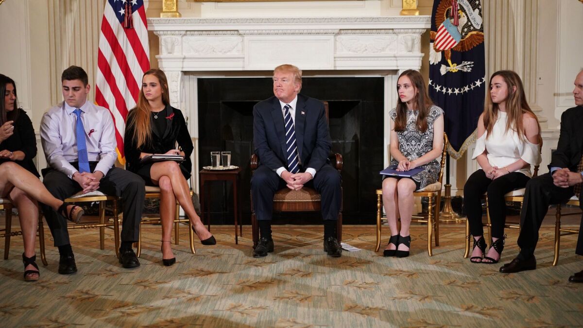 President Trump takes part in a listening session on gun violence with teachers and students at the White House on Feb. 21.