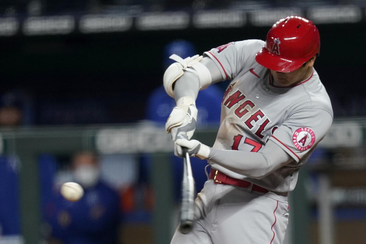 Angels designated hitter Shohei Ohtani hits a two-run double.