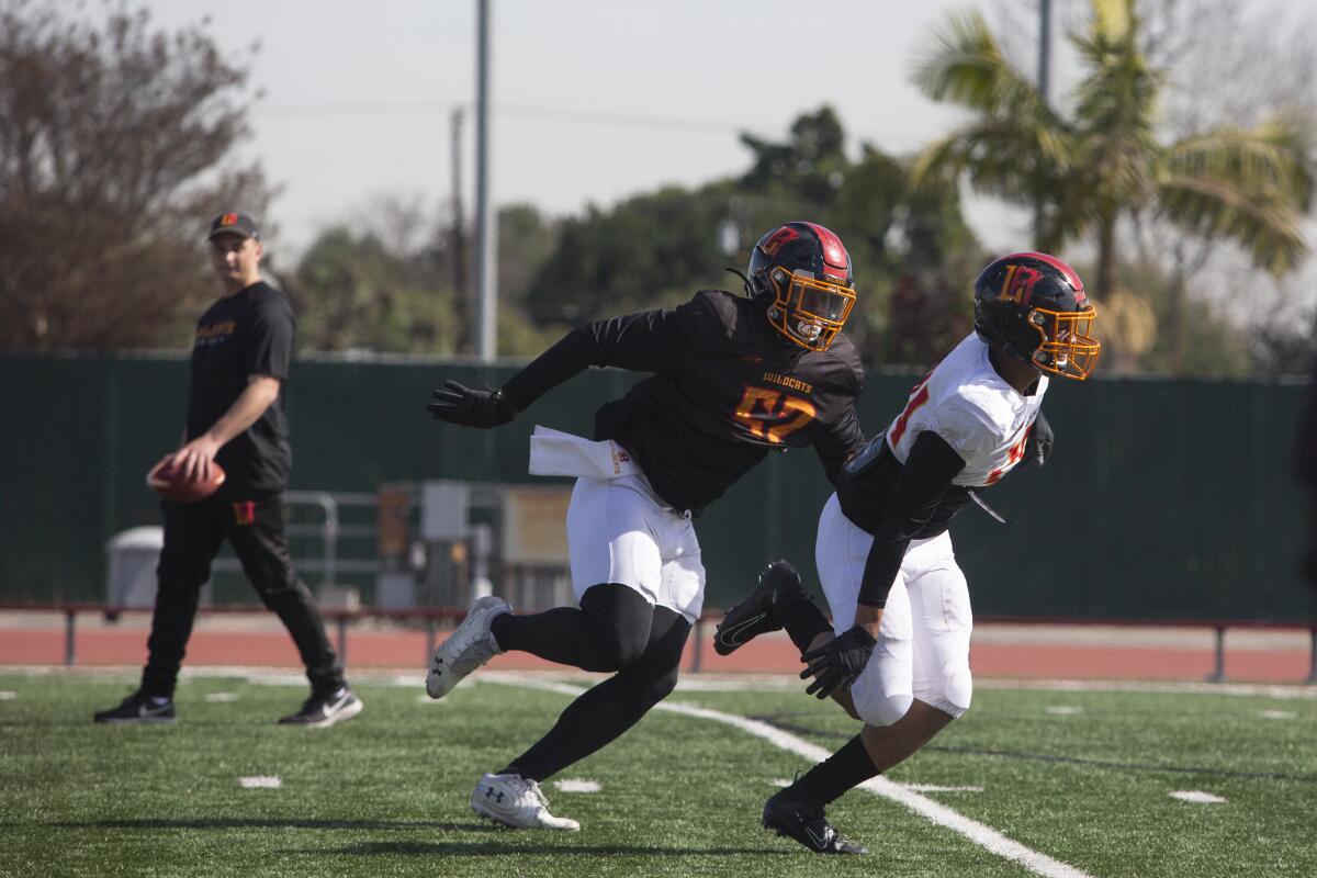 Tre Williams, center, runs a drill during practice Feb. 5 at Veteran's Memorial Stadium at Long Beach City College.