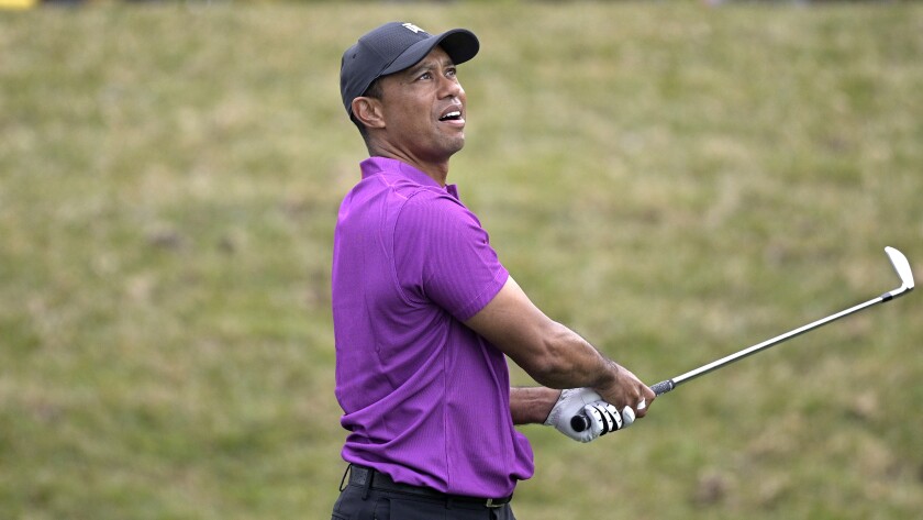 Tiger Woods watches a tee shot at the PNC Championship on Dec. 19, 2020, in Orlando, Fla.