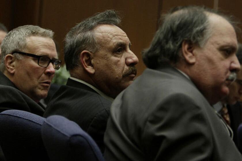 Three of the former Bell officials in court last year. From left, George Cole, Oscar Hernandez and Victor Bello.
