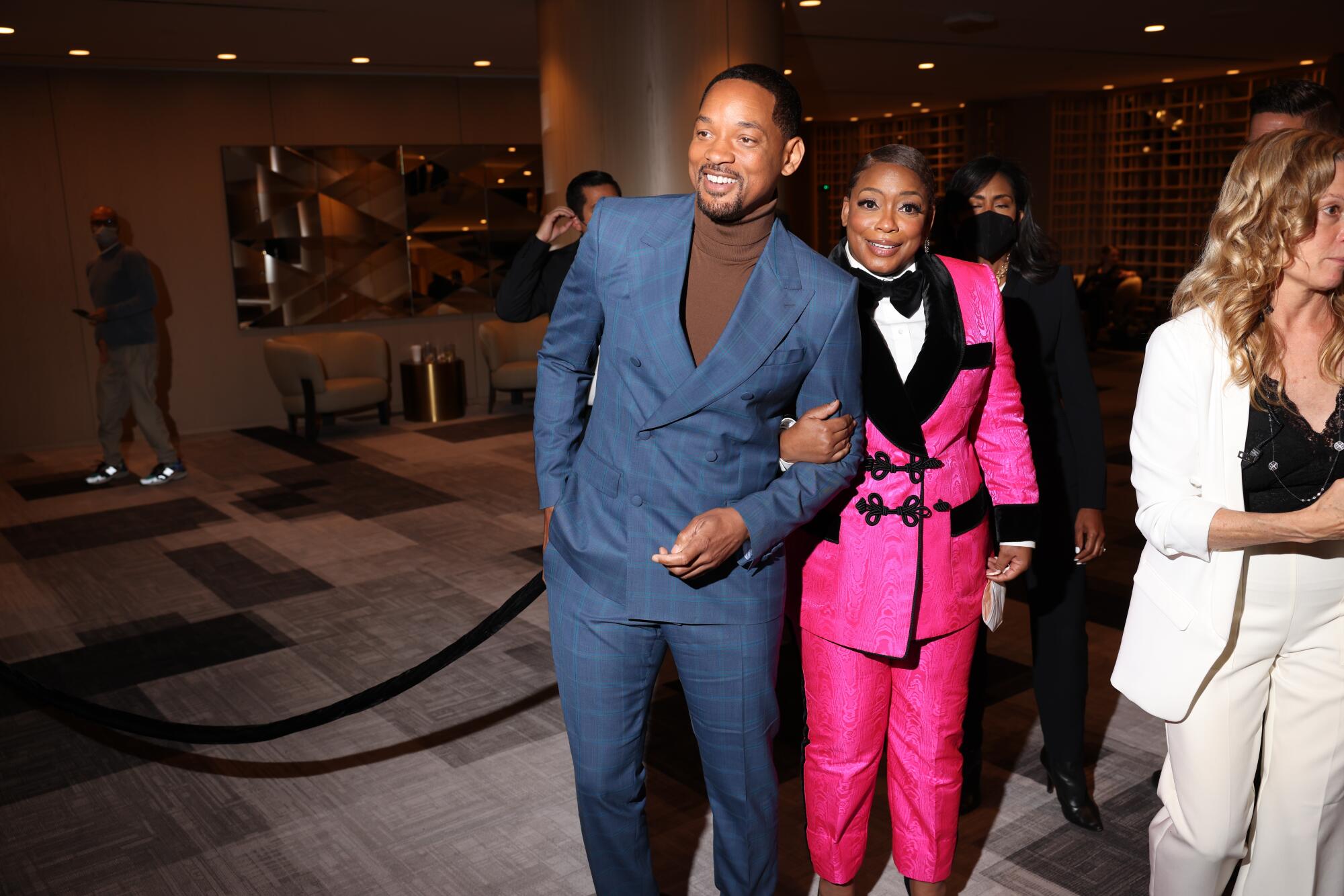 Will Smith, left, joined by Aunjanue Ellis.