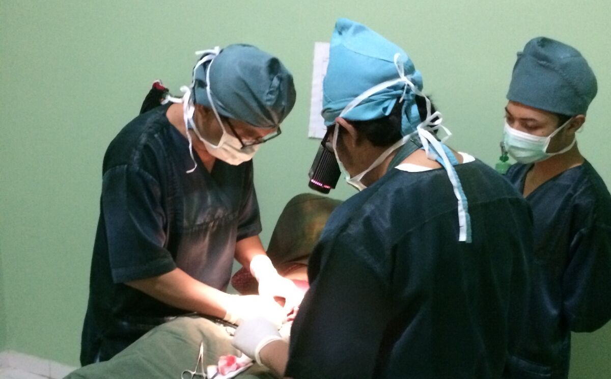 A team of doctors perform a vasectomy at the Nur Hidayah medical clinic outside Yogyakarta, Indonesia.
