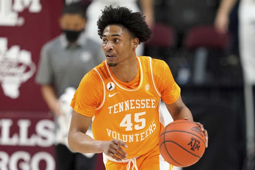 FILE - In this Jan. 9, 2021, file photo, Tennessee guard Keon Johnson brings the ball up against Texas A&M during an NCAA college basketball game in College Station, Texas. Johnson was chosen in the first round of the NBA draft Thursday, July 29, 2021. (AP Photo/Sam Craft, File)
