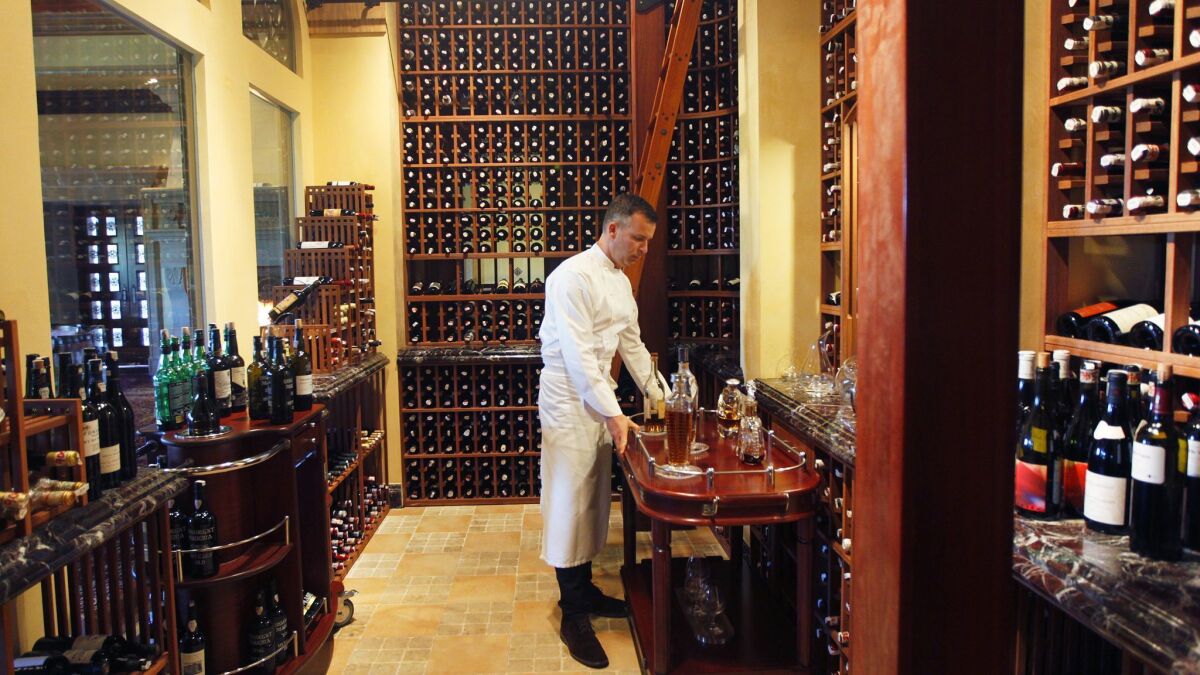 Addison executive chef William Bradley in the dining room cellar that holds about 3,000 of the restaurant's world-class 14,000-bottle collection