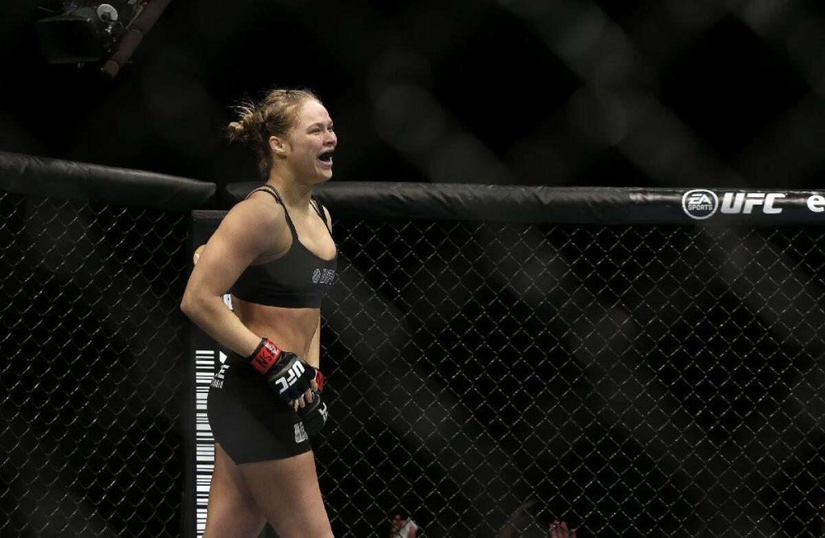 Ronda Rousey reacts after defeating Sara McMann on Saturday.