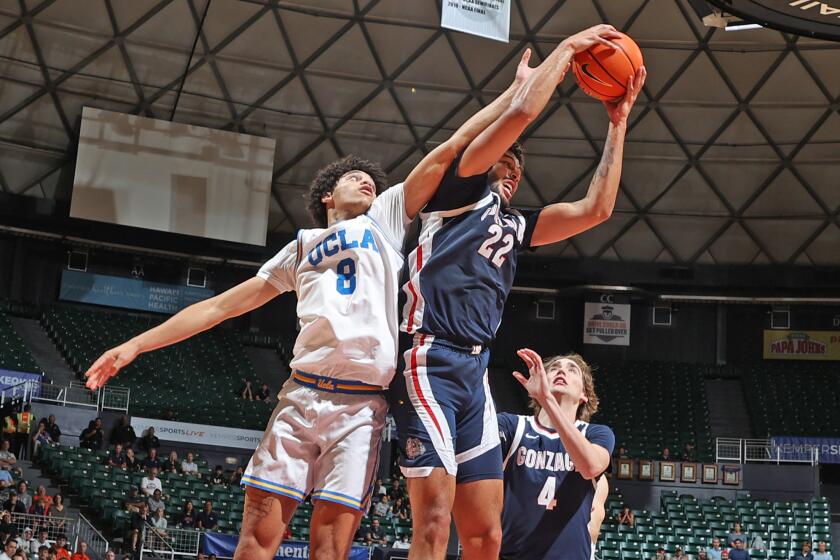 HONOLULU, HI - NOVEMBER 22: Gonzaga Bulldogs forward Anton Watson (22) grabs a rebound against UCLA Bruins forward Ilane Fibleuil (8) during the final round of the Allstate Maui Invitational on November 22, 2023, at the Stan Sheriff Center in Honolulu, Hawaii. (Photo by Brian Spurlock/Icon Sportswire via Getty Images)