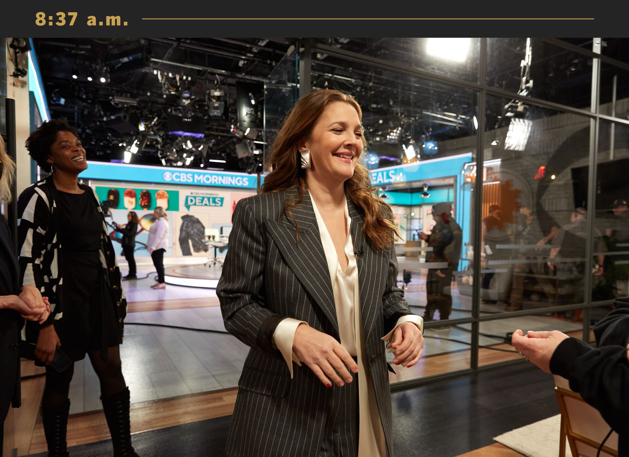 Drew Barrymore smiles walking off the set of "CBS This Morning."