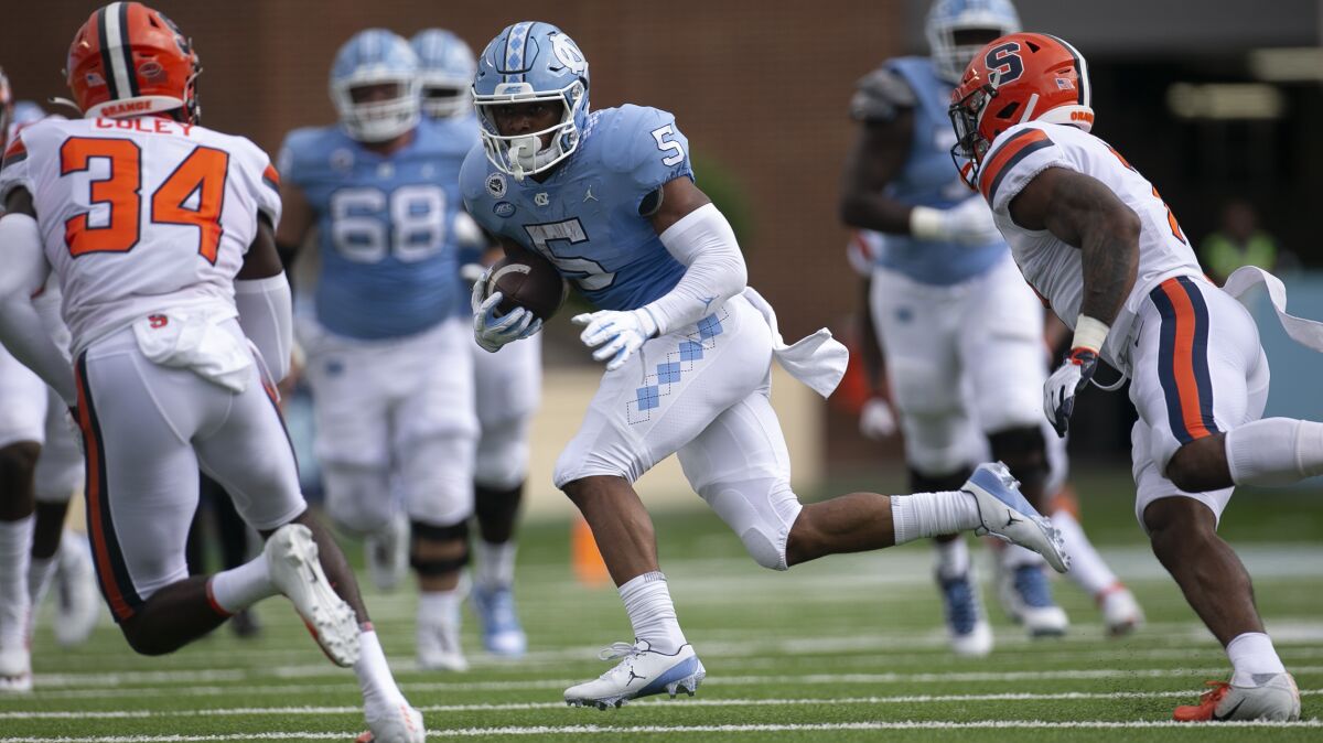 North Carolina's Dazz Newsome looks for running room against Syracuse on Saturday.