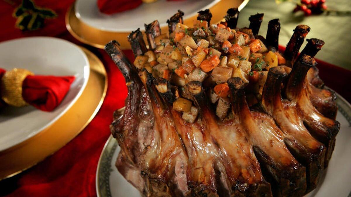 Spiced crown pork roast with glazed root vegetables