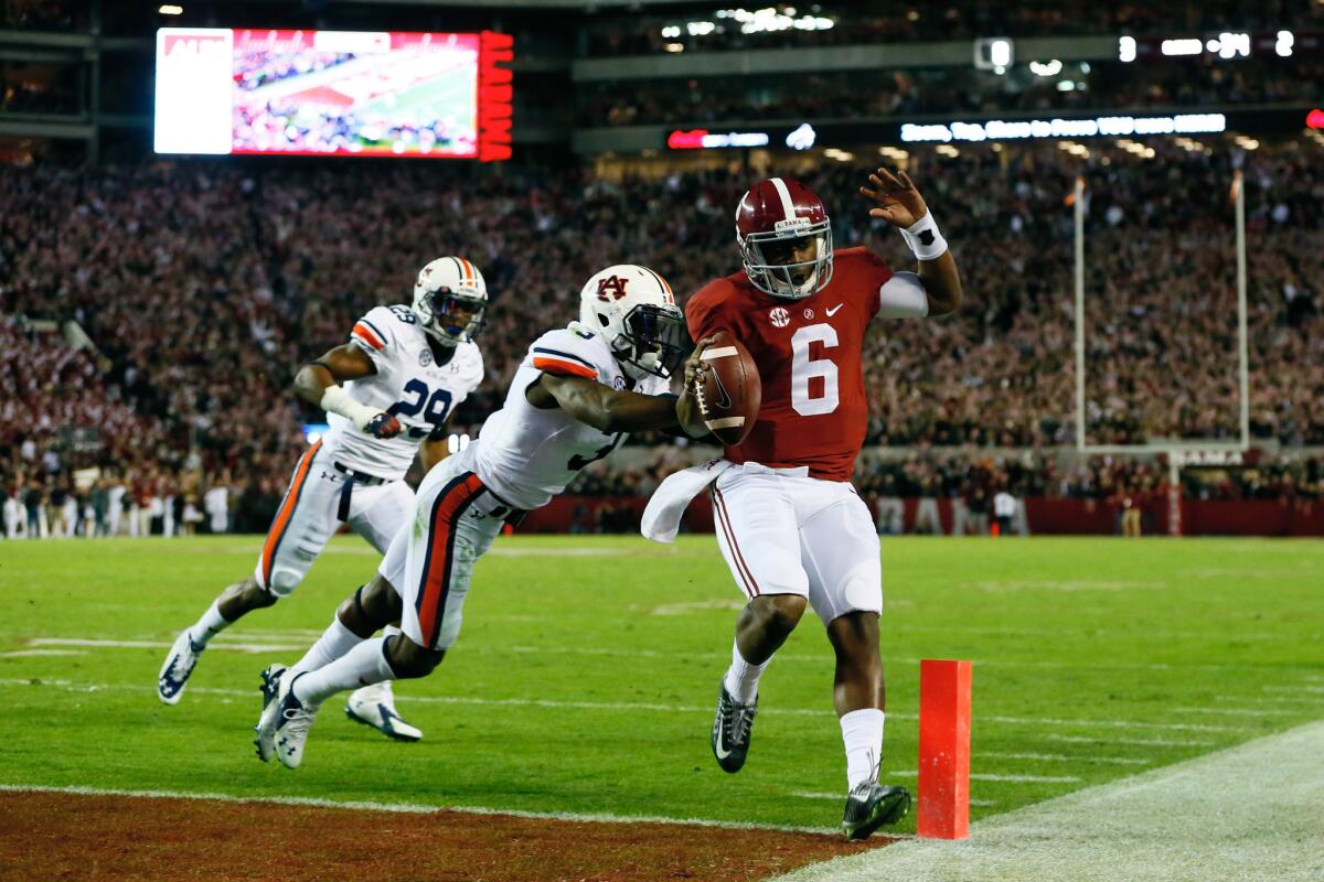 Alabama quarterback Blake Sims runs 11 yards for the go-ahead touchdown in the fourth quarter Saturday en route to a 55-44 victory over Auburn.