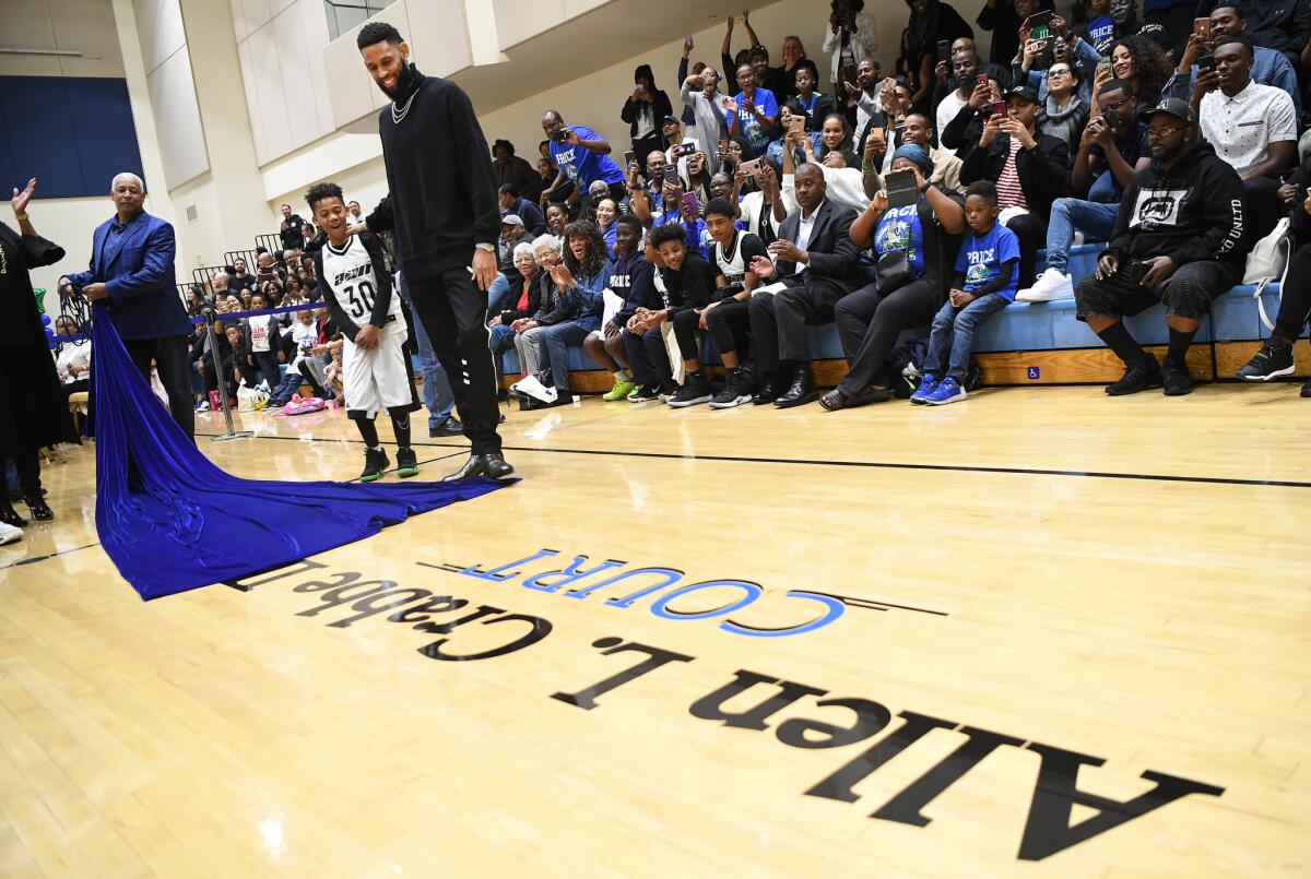Allen Crabbe watches as his name is unveiled on the court at the Crenshaw Christian Center, home of Price High.
