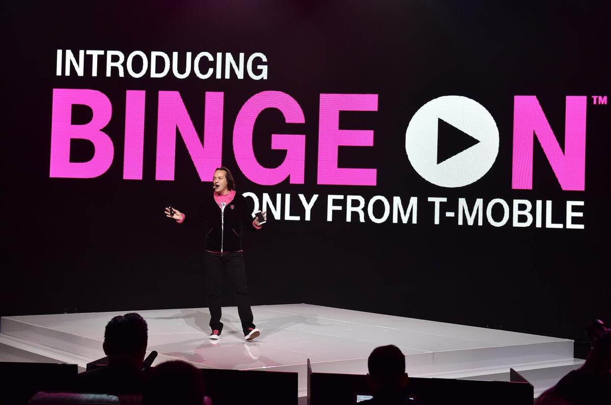 T-Mobile CEO John Legere introduces Binge On during a press conference at the Shrine Auditorium on Tuesday. Binge On allows T-Mobile customers to stream video for free without counting against their monthly data allowance.