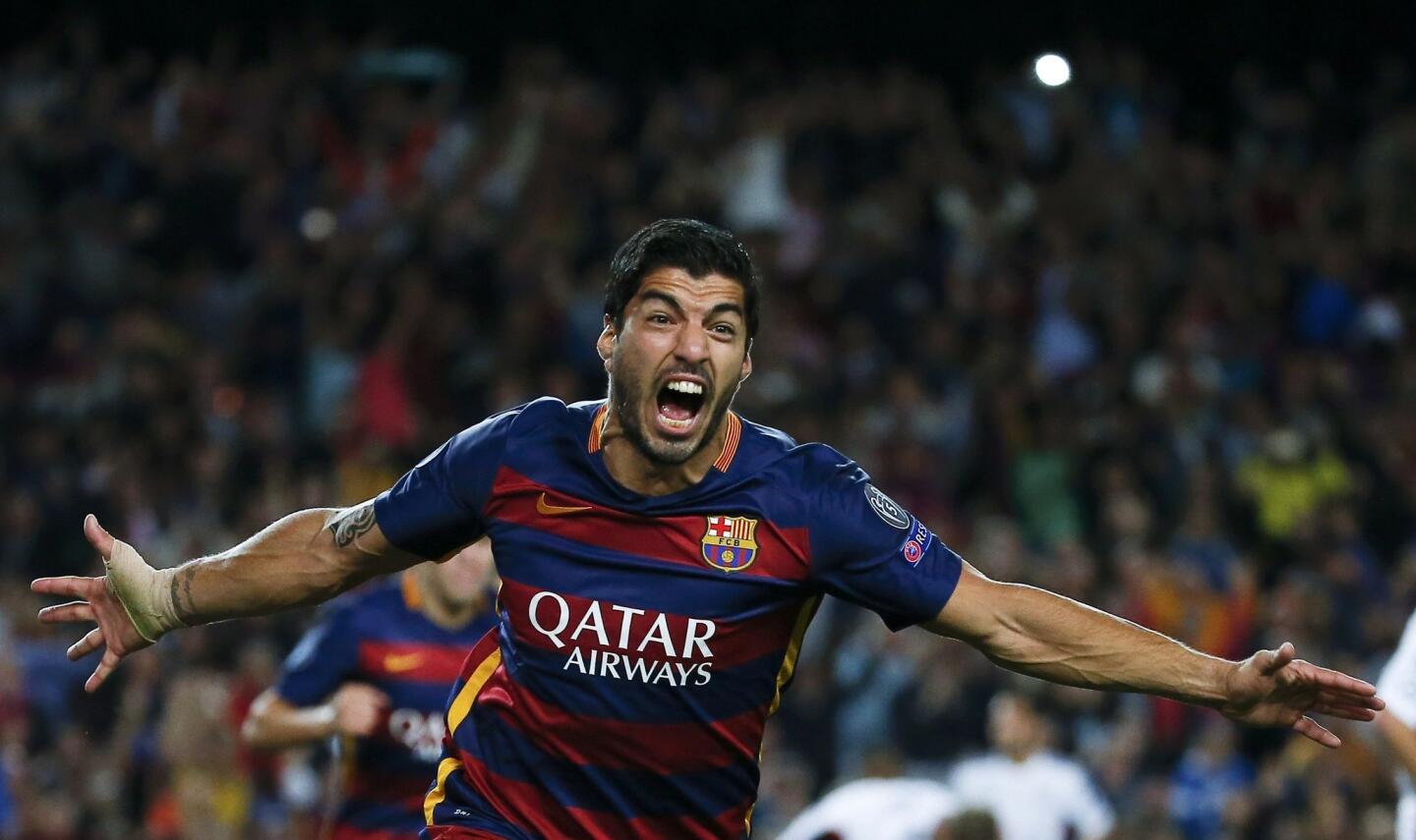 Barcelona's Luis Suarez celebrates after scoring a goal against Bayer Leverkusen during their Champions League group E soccer match at Camp Nou stadium in Barcelona