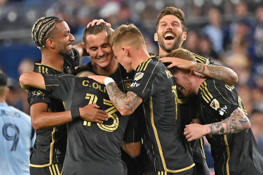 KANSAS CITY, KS - OCTOBER 05: Aaron Long (C) of Los Angeles FC celebrates with his teammates.