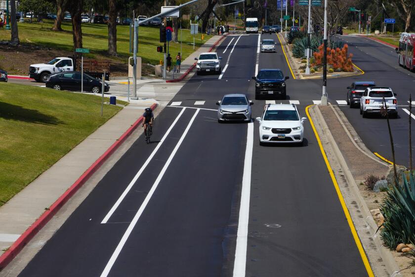 San Diego, CA - April 19: Wednesday, April 19, 2023 in San Diego, CA., paving is complete, and striping is underway on Park Boulevard. Crews are expected to wrap up striping by the end of the week. The new design includes a vehicle lane, a dedicated bus lane, a separated bike lane and a high-visibility crosswalk. Also taking away street parking. (Nelvin C. Cepeda / The San Diego Union-Tribune)