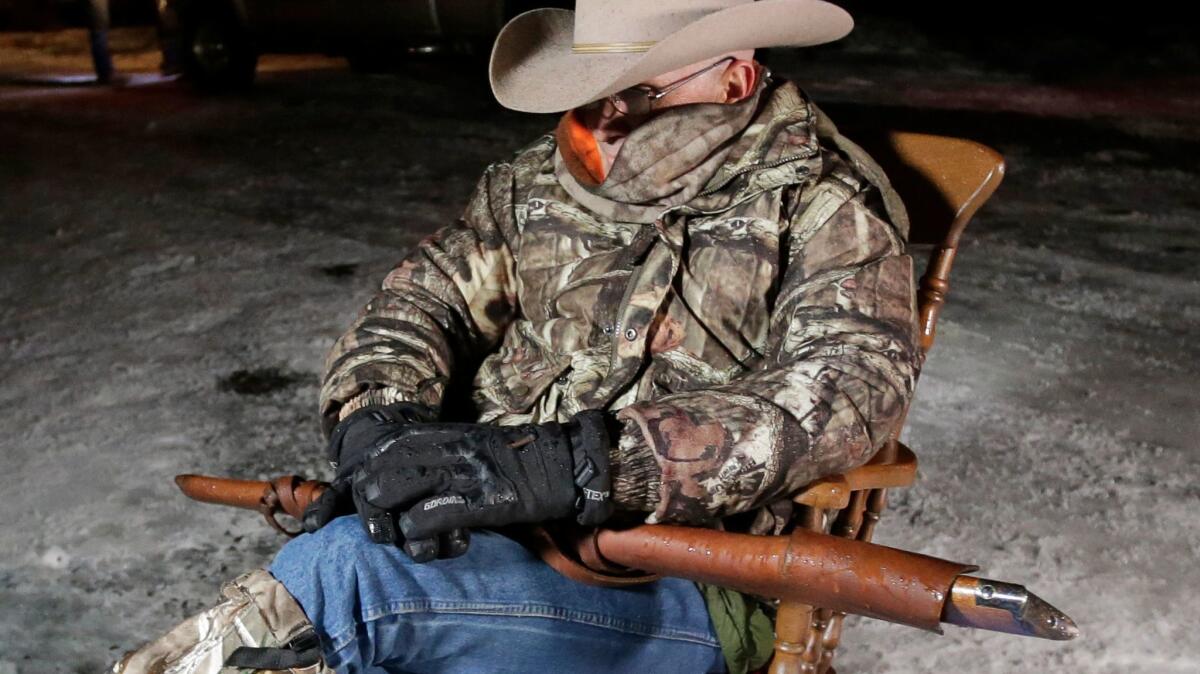 Arizona rancher LaVoy Finicum holds a rifle as occupies the Malheur National Wildlife Refuge near Burns, Ore., on Jan. 5.