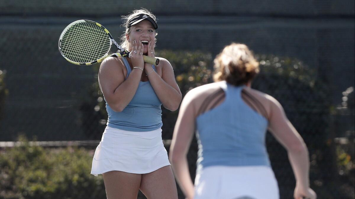 Corona del Mar High doubles players Kristina Evloeva, left, and Roxy MacKenzie react after losing the first set 7-5 to Los Angeles Marlborough's Jordan Hickey and Arianna Stavropoulos in the CIF Southern Section Individuals semifinals at Seal Beach Tennis Center on Friday.